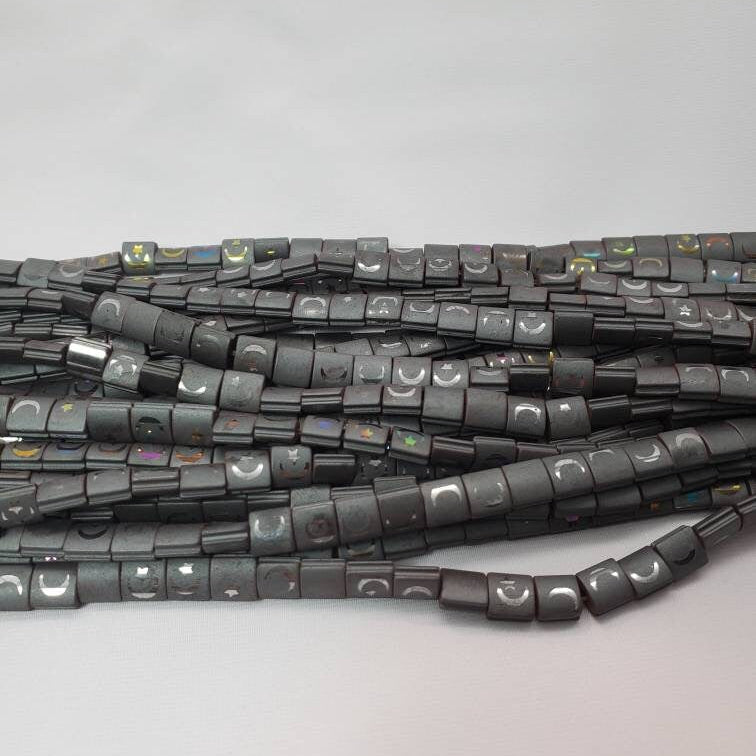 String of black beads on a light gray background