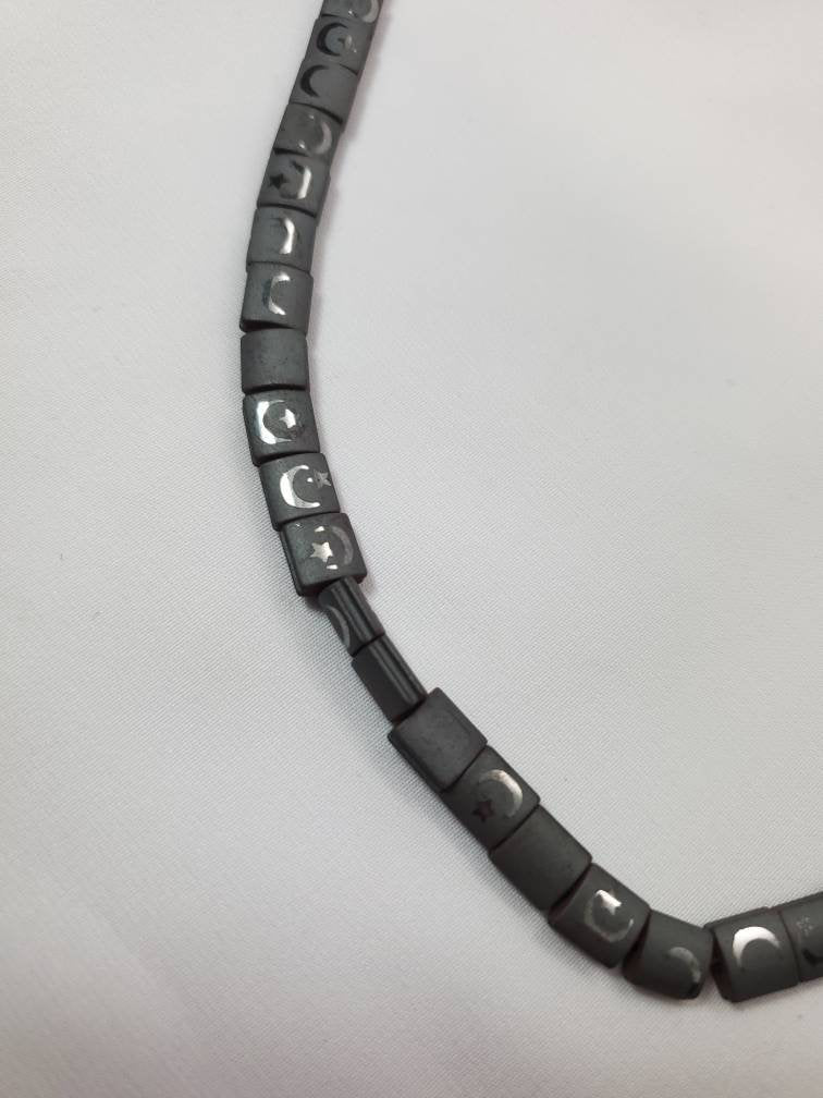 Charcoal Gray Hematite Beads With Rainbow Refelctive Moon and Star Design