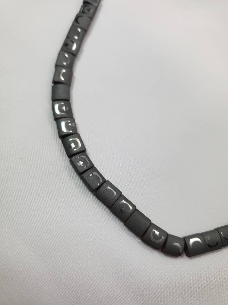 Charcoal Gray Hematite Beads With Rainbow Refelctive Moon and Star Design